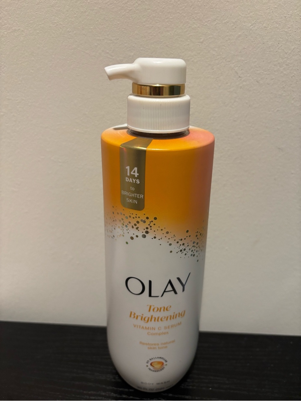 OLAY Brightening Skin Lotion - White and Orange Bottle